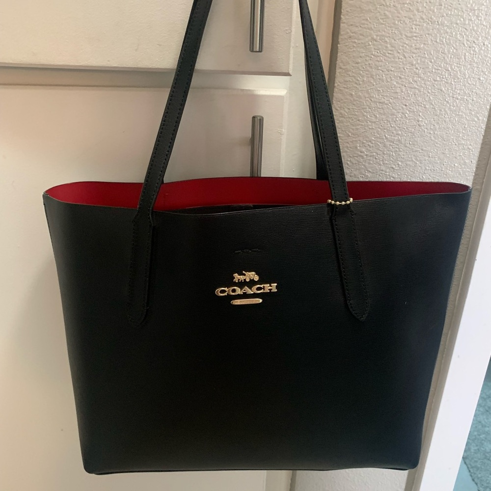 This is a black coach tote bag
